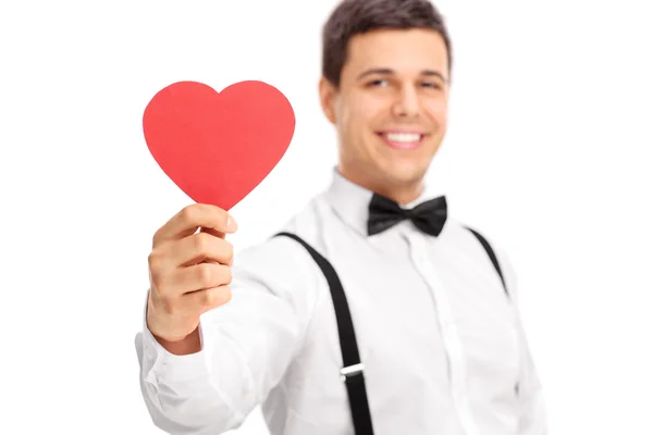 Guy holding heart shaped cardboard — Stock Photo, Image