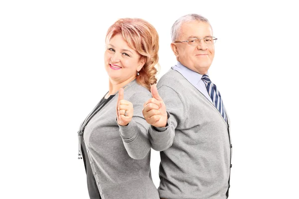Mature couple giving thumbs up — Stock Photo, Image