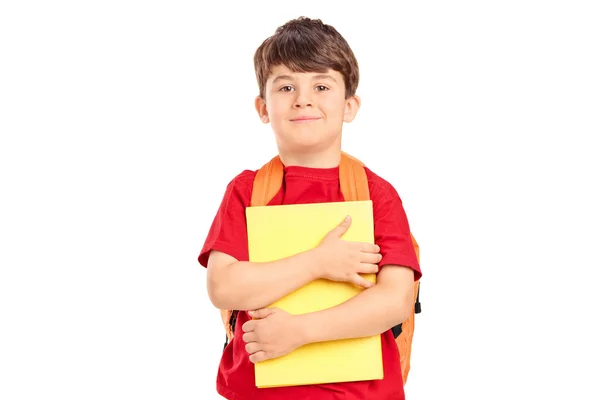 Schoolboy with backpack holding books — Stock Photo, Image