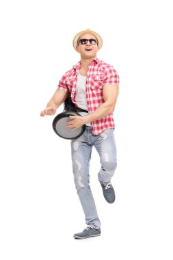 Man playing on doumbek and dancing clipart