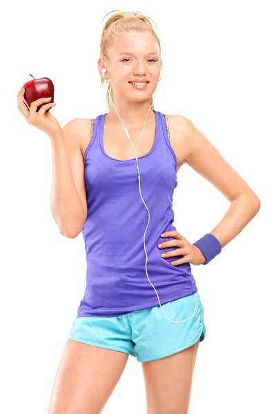 Blond woman holding red apple — Stock Photo, Image