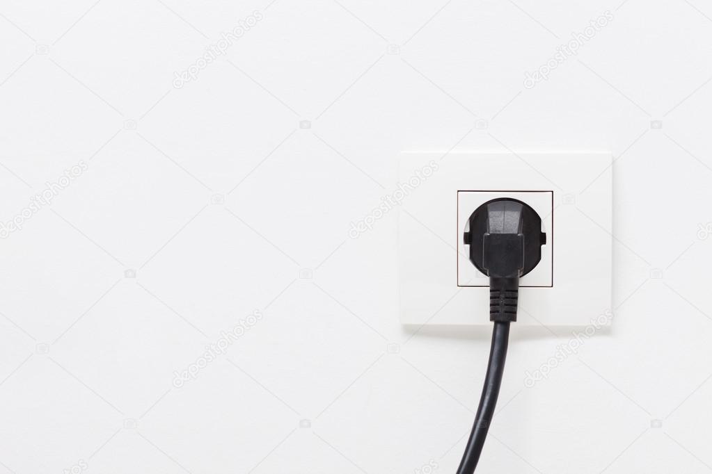 Electric cord plugged into socket