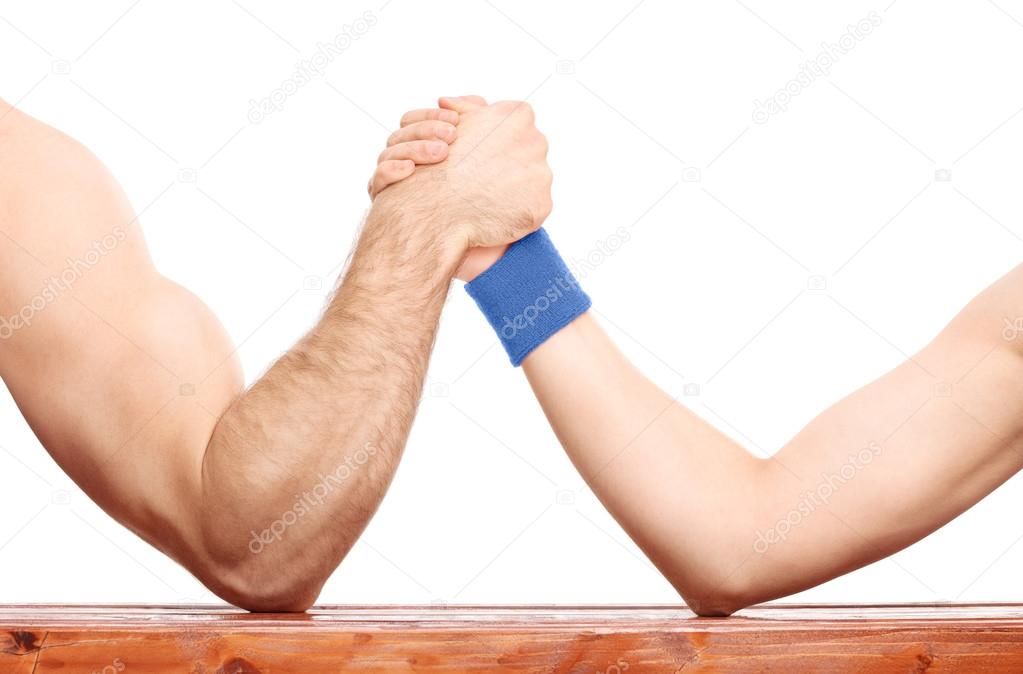 Arm wrestling between muscular and skinny