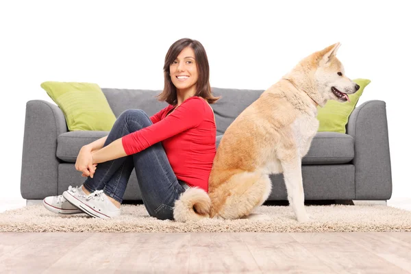Girl on the floor with her dog — Stock Photo, Image