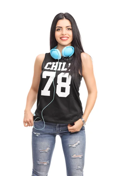 Woman in a hip hop outfit with headphones — Stock Photo, Image