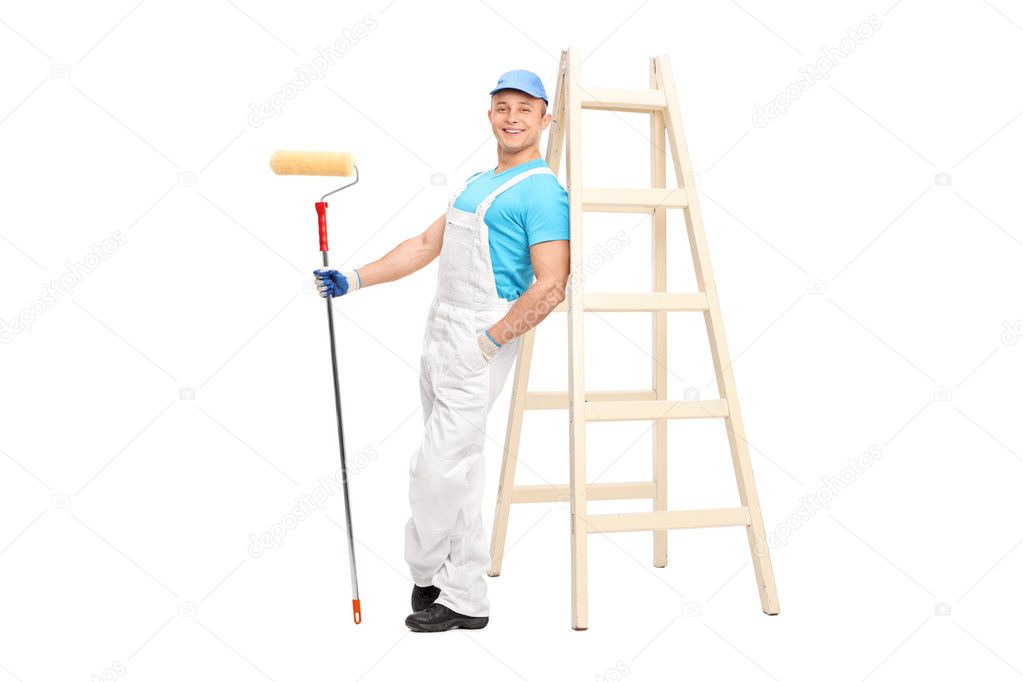 Male decorator holding a paint roller