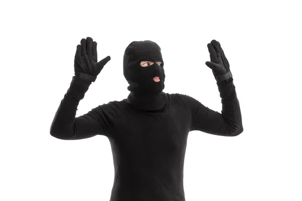 Thief in black costume surrendering to someone — Stock Photo, Image