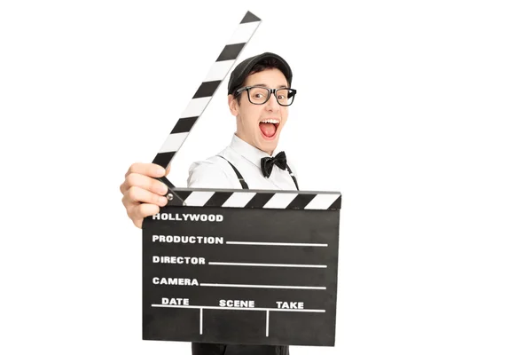 Excited movie director behind a clapperboard — Stock Photo, Image