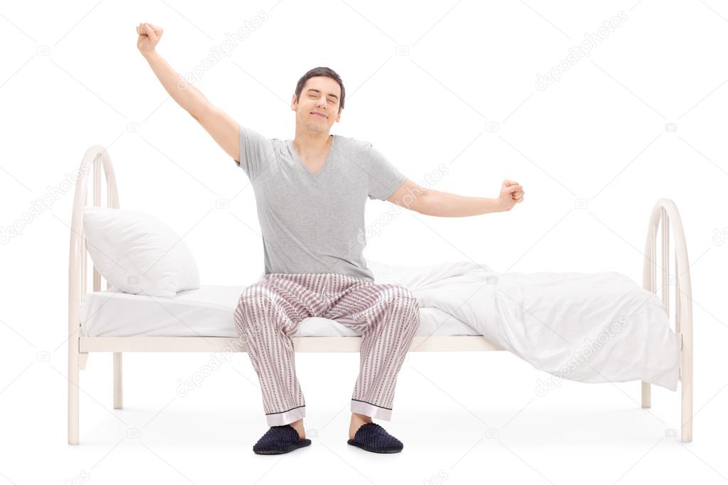 Man waking up and stretching