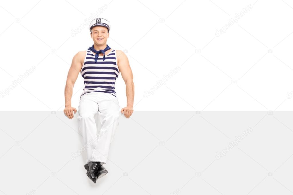 Man in sailor outfit on a blank billboard