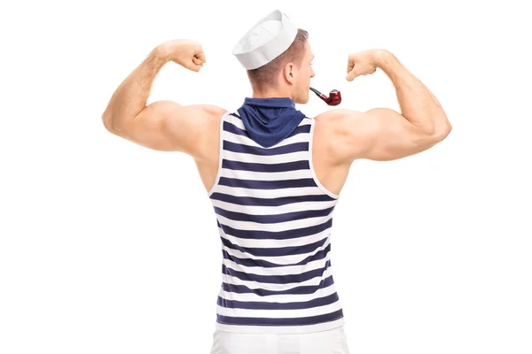 Gespierde man buigen zijn biceps — Stockfoto