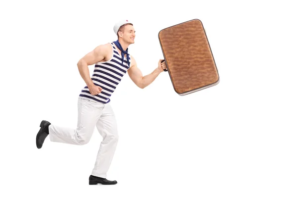 Young man in a sailor clothes  running — Stock Photo, Image