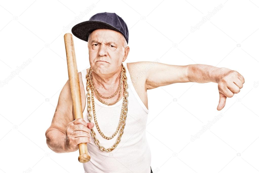 Violent senior with baseball bat giving a thumb down 