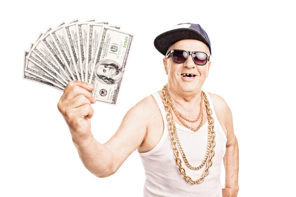 Toothless old man holding cash