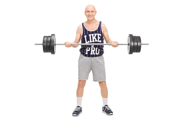 Senior man uitoefenend met een barbell — Stockfoto