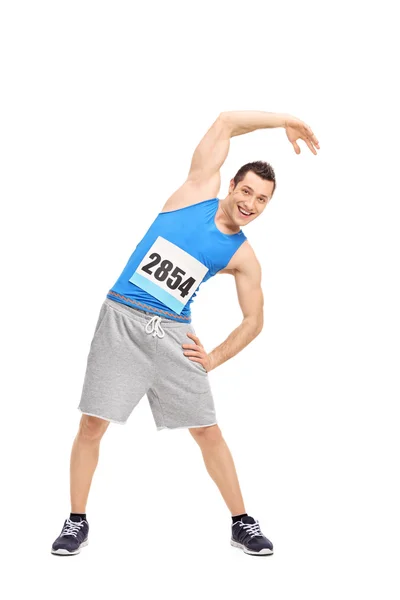 Male runner doing stretching exercise — Stock Photo, Image