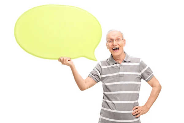 Senior man holding a speech bubble — Stock Photo, Image