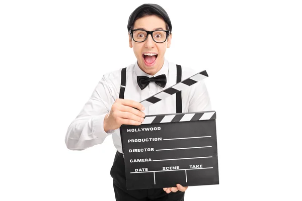 Excited movie director holding a clapperboard — Stock Photo, Image