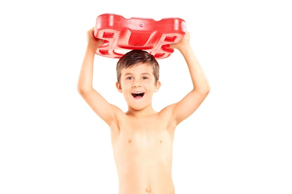 Overjoyed boy holding a swimming float — Stock Photo, Image