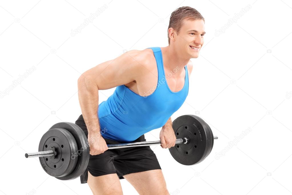 Muscular bodybuilder lifting a weight