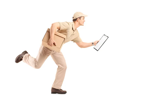 Delivery guy running with a cardboard box — Stock Photo, Image