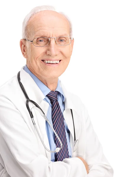 Mature doctor carrying a stethoscope Royalty Free Stock Images