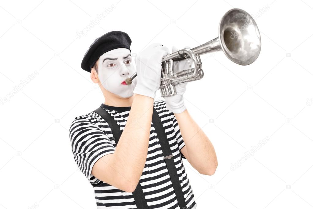 male mime artist playing a trumpet