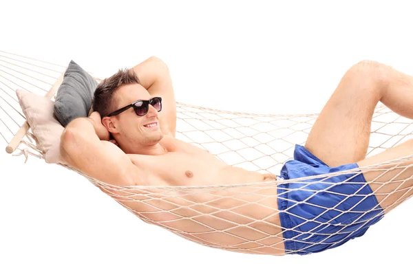 Relaxed young guy lying in a hammock — Stock Photo, Image