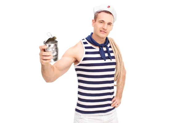 Sailor crushing a can with bare hands — Stock Photo, Image