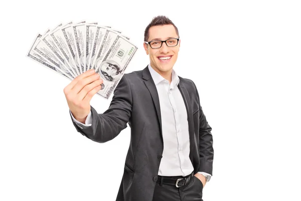 Erfolgreicher Geschäftsmann mit einem Stapel Geld — Stockfoto