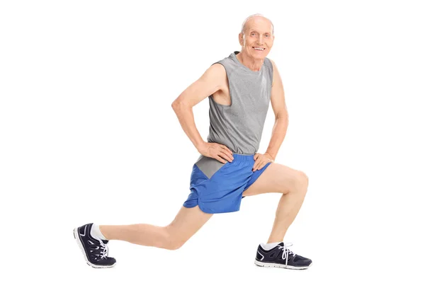 Senior man doing a stretch exercise — Stock Photo, Image