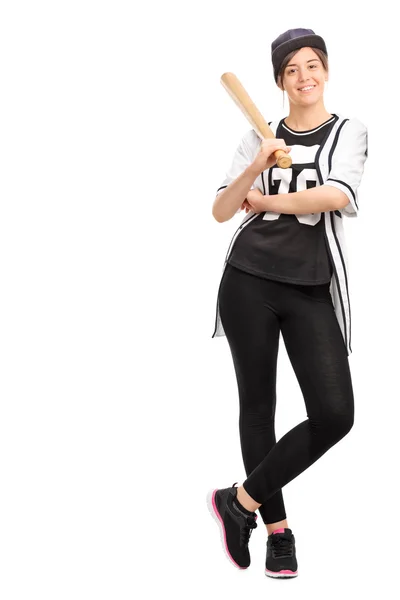 Woman in a baseball jersey holding a bat — Stock Photo, Image