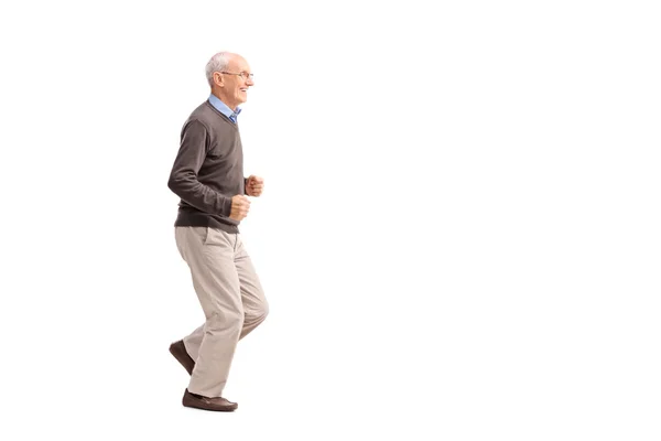 Uomo anziano correre e sorridere — Foto Stock