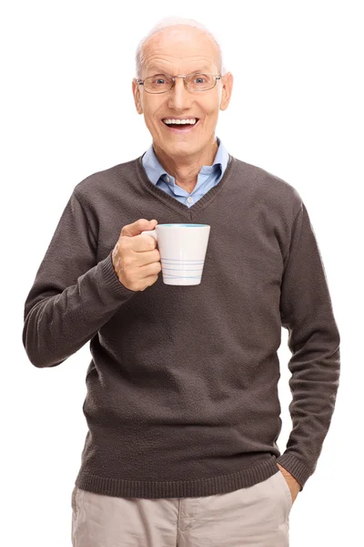 Homem sênior segurando um copo de café — Fotografia de Stock