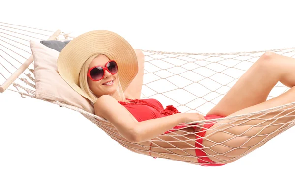 Beautiful blond woman lying in a hammock — Stock Photo, Image