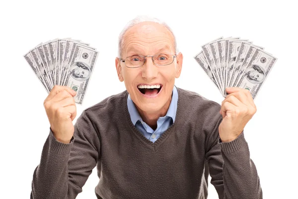 Senior hält Geld in der Hand — Stockfoto