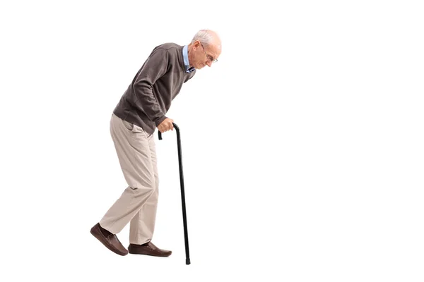 Exhausted old man walking with a cane — Stock Photo, Image