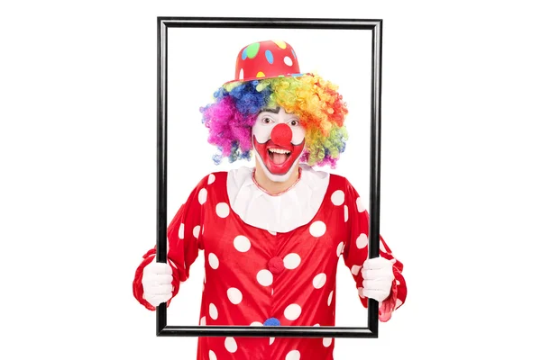 Clown mit einem großen Bilderrahmen — Stockfoto