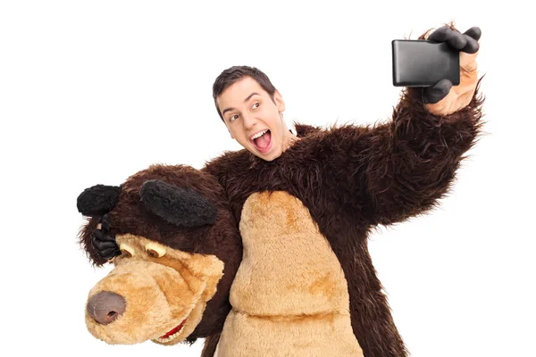 Man in a bear costume taking a selfie — Zdjęcie stockowe