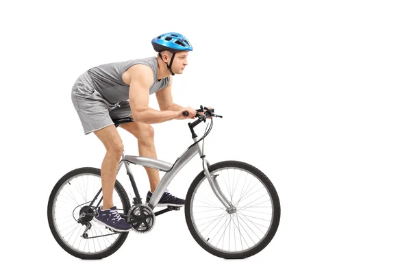 Young male biker riding a gray bicycle — Zdjęcie stockowe