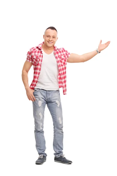 Casual young man gesturing with his hand — Stockfoto