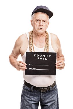 Senior gangster posing for a mug shot 