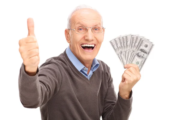 Senior gentleman with money and thumb up — Stock Fotó