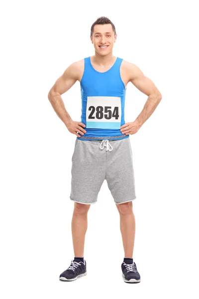 Male runner in blue jersey with a number — 图库照片