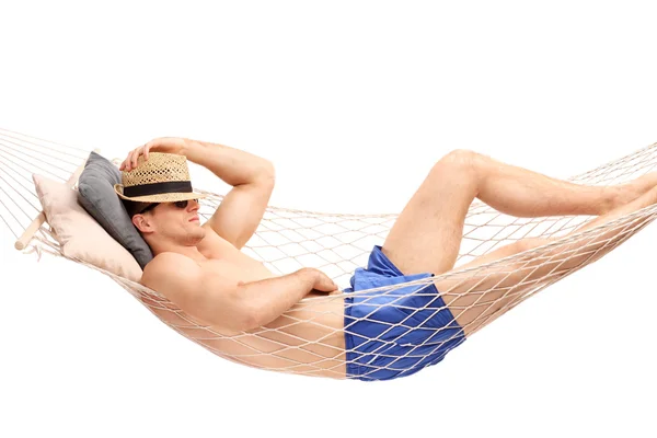 Guy sleeping in a hammock — Stok fotoğraf