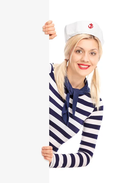 Female sailor behind a blank signboard — Stock Photo, Image