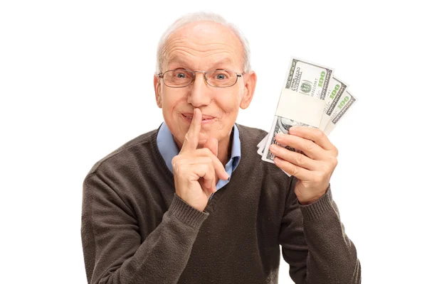 Senior gentleman houden stapels van geld — Stockfoto