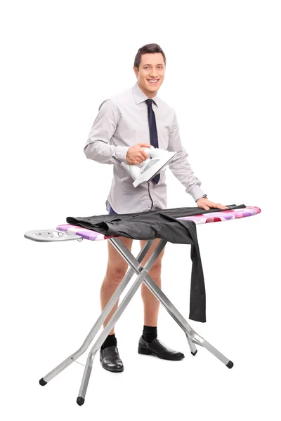 Young man ironing his pants — Stock Photo, Image