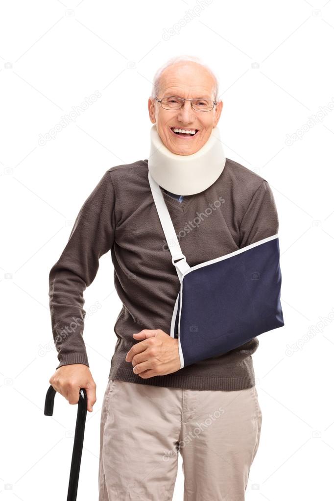 Senior man with a broken arm smiling 