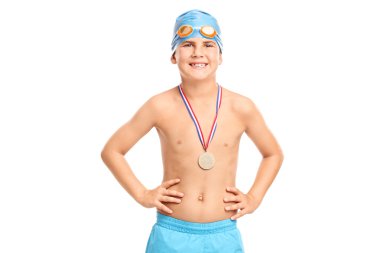 Junior swimming champion in swim trunks